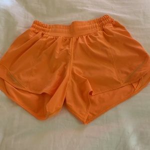 Lululemon Hotty hot shorts in size 6 with a length of 4 inches, orange soda.
